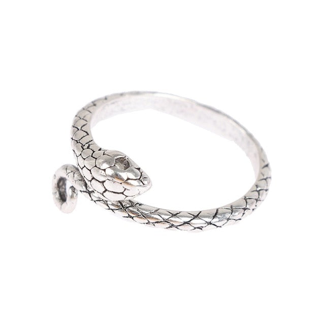 Silver snake tension ring for knitting, Crochet tension ring with snake design, Silver yarn tension tool, Knitting accessory with snake motif, Crochet accessory featuring silver snake, Snake ring for crochet, Yarn tension tool with snake design, Silver snake knitting ring, Knitting and crochet ring with snake design, Metallic tension ring with snake motif, Snake tension regulator for crochet, Silver snake tension regulator for knitting