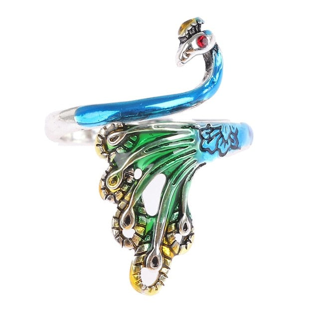 Rainbow peacock tension ring for knitting, Crochet tension ring with peacock design, Rainbow-colored yarn tension tool, Knitting accessory with peacock motif, Crochet accessory featuring rainbow peacock, Peacock ring for crochet, Yarn tension tool with vibrant peacock design, Rainbow peacock knitting ring, Knitting and crochet ring with peacock design, Colorful tension ring for knitting, Peacock tension regulator for crochet, Rainbow peacock tension regulator for knitting